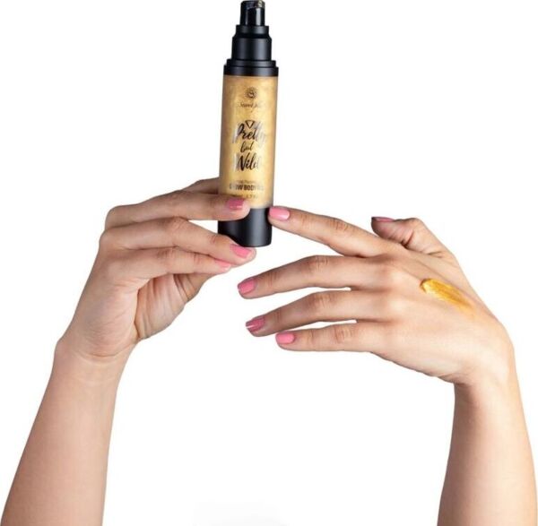 Bottle of Secret Play Glow Body Oil Pretty But Wild shimmer body oil