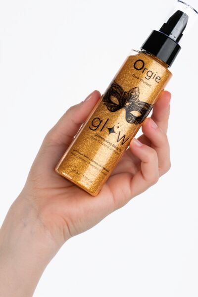Spray bottle of Orgie Glow Shimmering body oil, 110 ml