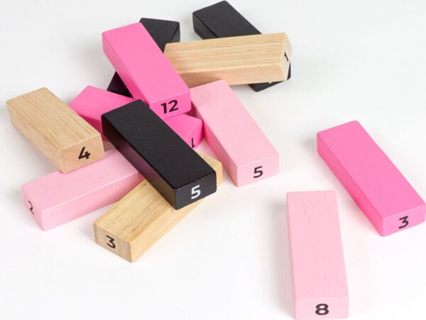 Secret Play Tower of Sex couples game, with the tower of wooden pieces in four colours and its dice