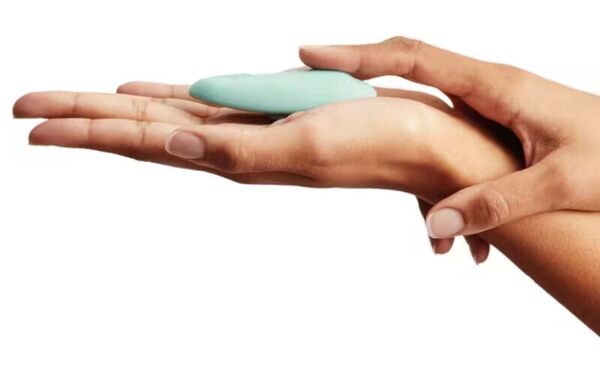 We-Vibe Moxie+ panty vibrator in aqua, with its magnetic clip
